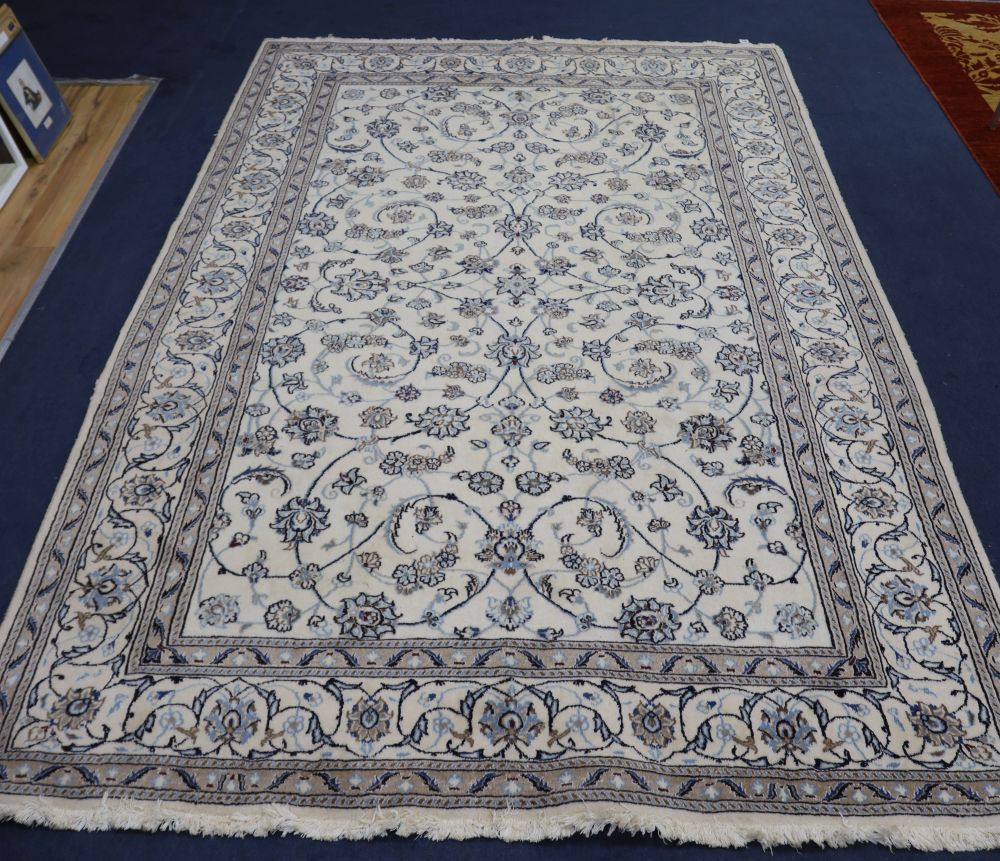 A Persian ivory ground carpet, 300 x 200cm